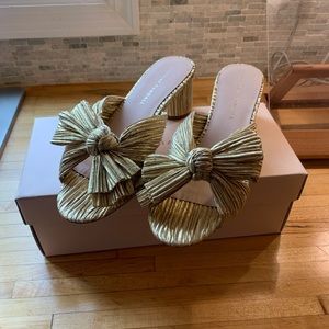 Emilia gold pleaded bow sandal / metallic knot mule.
